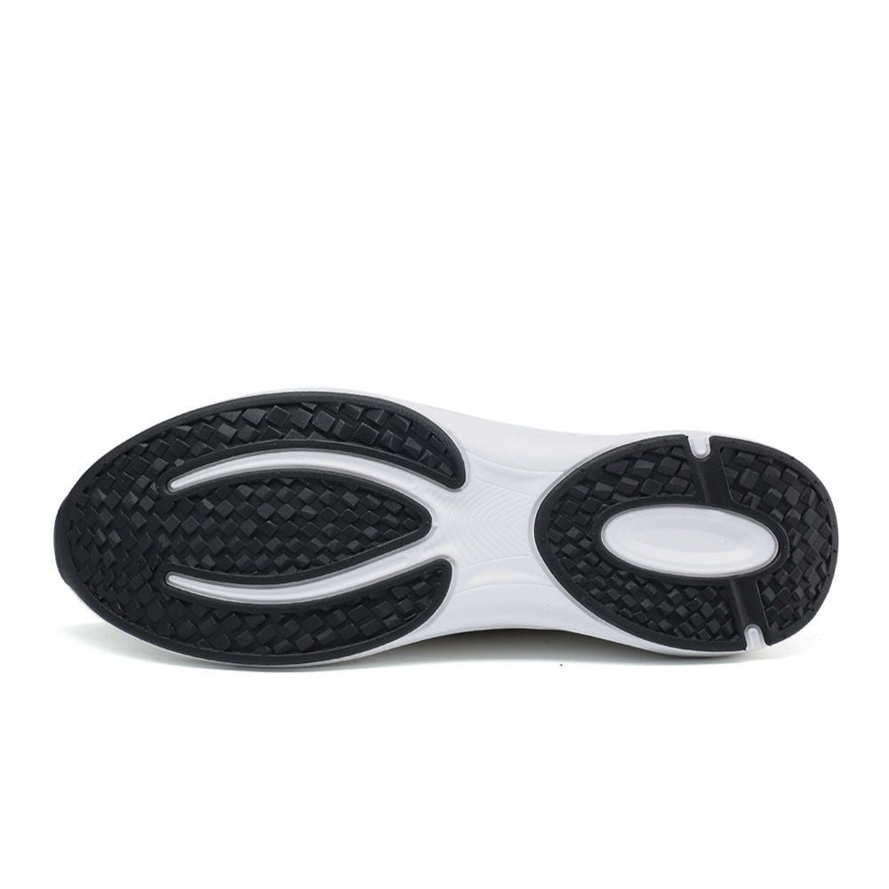 Close-up of a shoe sole with black and white tread pattern on a white background