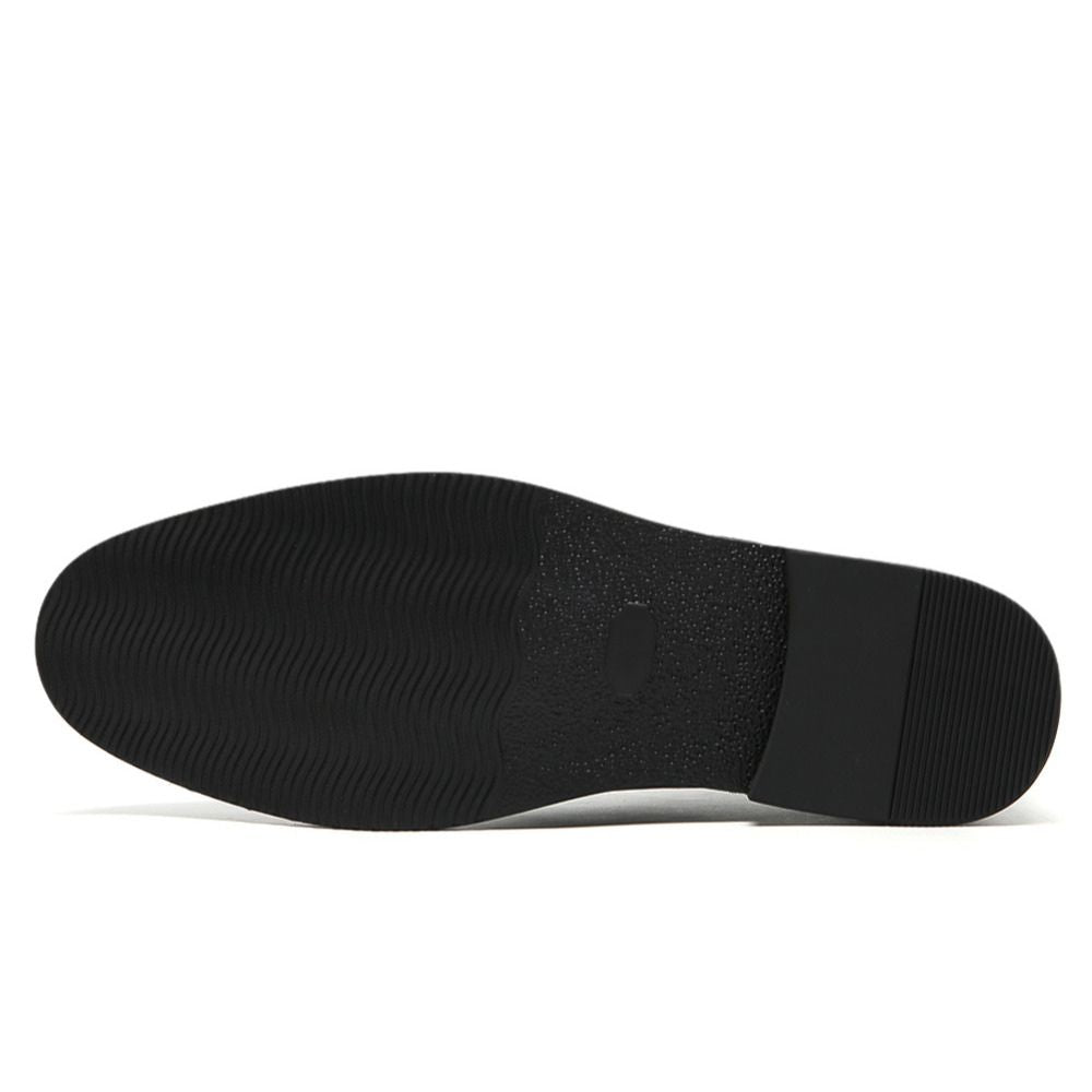 Height-increasing elevator shoes Black shoe sole on a white background