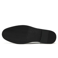 Height-increasing elevator shoes Black shoe sole on a white background