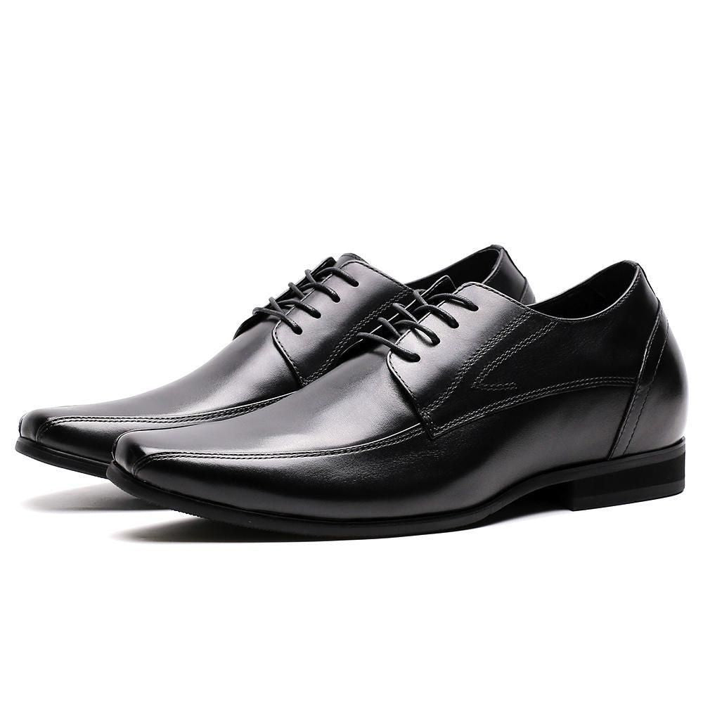 Pair of black leather classic elevator business formal footwear