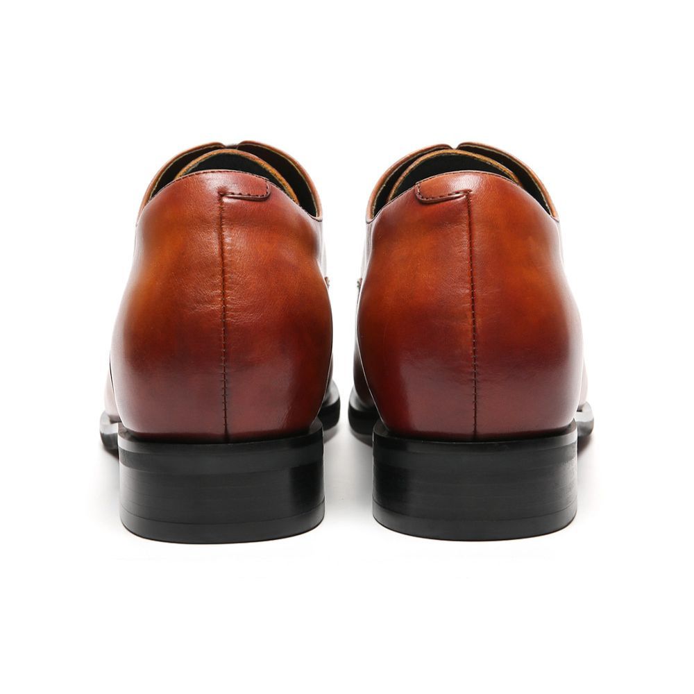Pair of brown leather shoes with 7cm hight increase