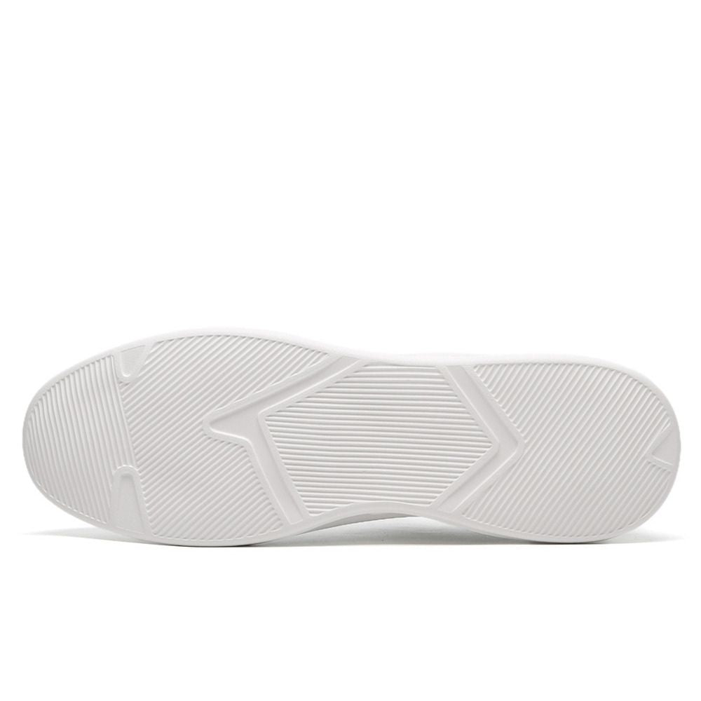Outsoles of white elevator sneakers