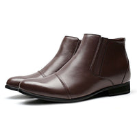 Brown elevator boots for men on wooden surface, emphasizing smooth polished leather and total 8 cm height increase
