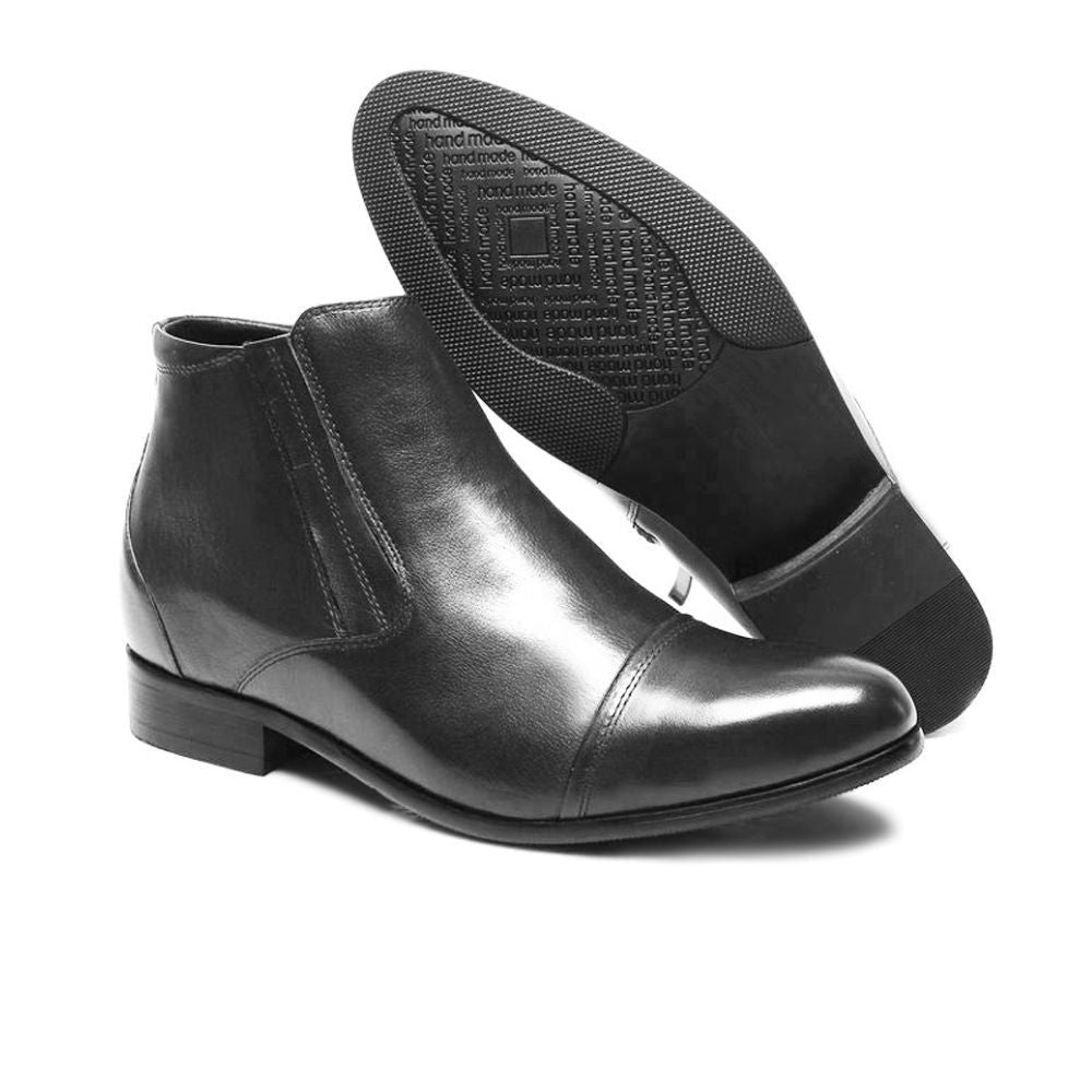 Close-up of Mr. Ferras black boots showing functional zip-up design and polished leather finish