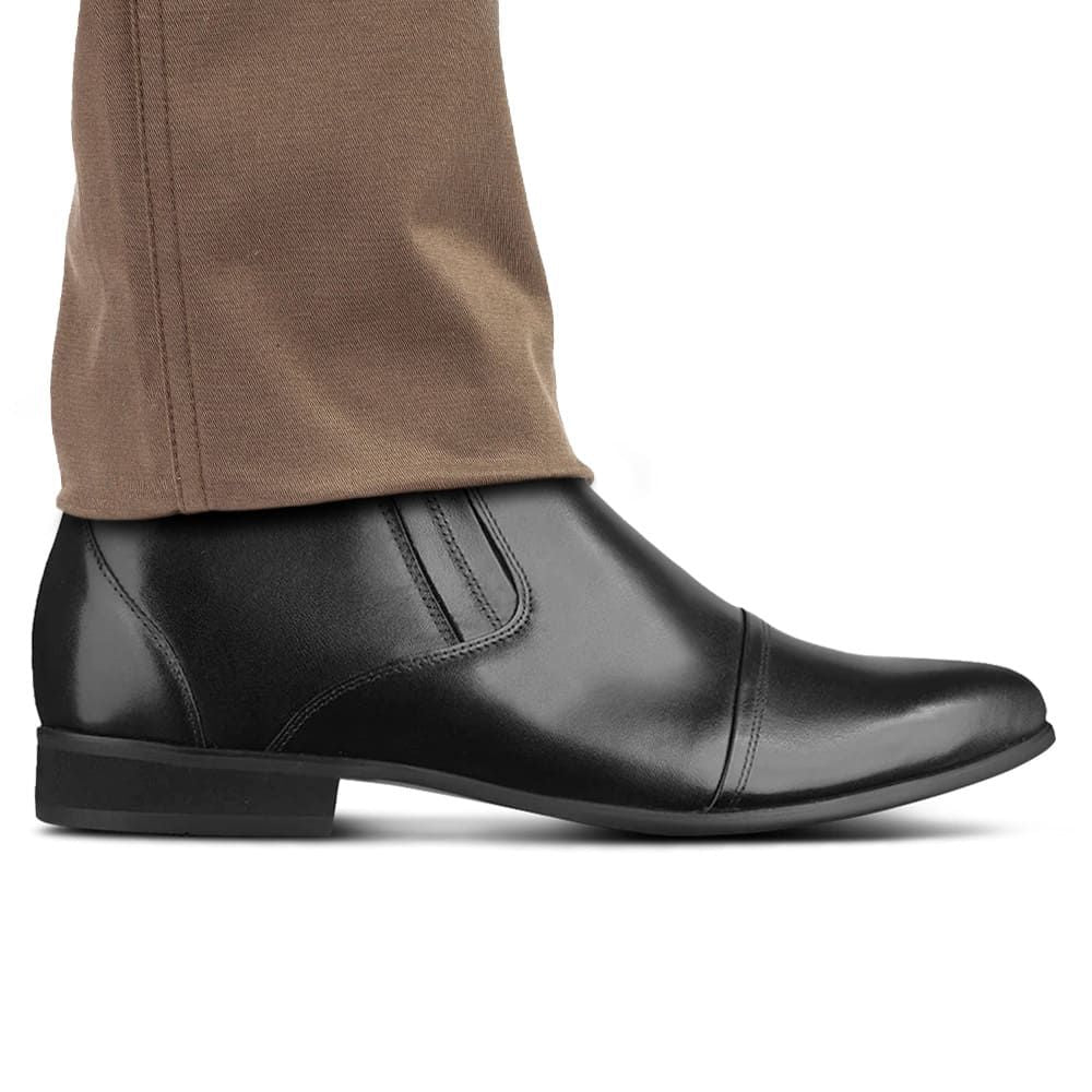 Side view of Mr. Ferras black vegan elevator boots showing 8 cm total height increase.