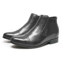Close-up of Mr. Ferras black vegan boots showing zip-up closure and polished finish