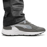 Mr. Gunther grey sport shoes worn with pants, highlighting height boost and sporty design.