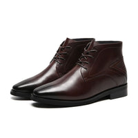 Pair of Mr. Hemingway brown leather elevator boots showing rugged design and hidden lift insole