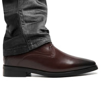 Mr. Hemingway brown elevator boots worn with pants, highlighting subtle height boost and sleek profile.