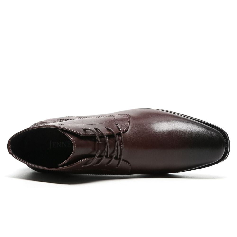 Angled view of Mr. Hemingway brown boots highlighting smooth leather finish and subtle height increase.