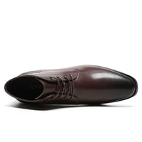 Angled view of Mr. Hemingway brown boots highlighting smooth leather finish and subtle height increase.