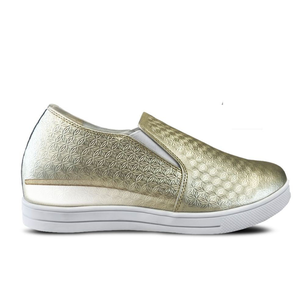 Gold patterned slip-on shoe with white sole on a white background