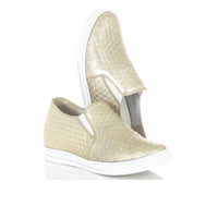 Gold slip-on wedge sneakers with white soles on a white background
