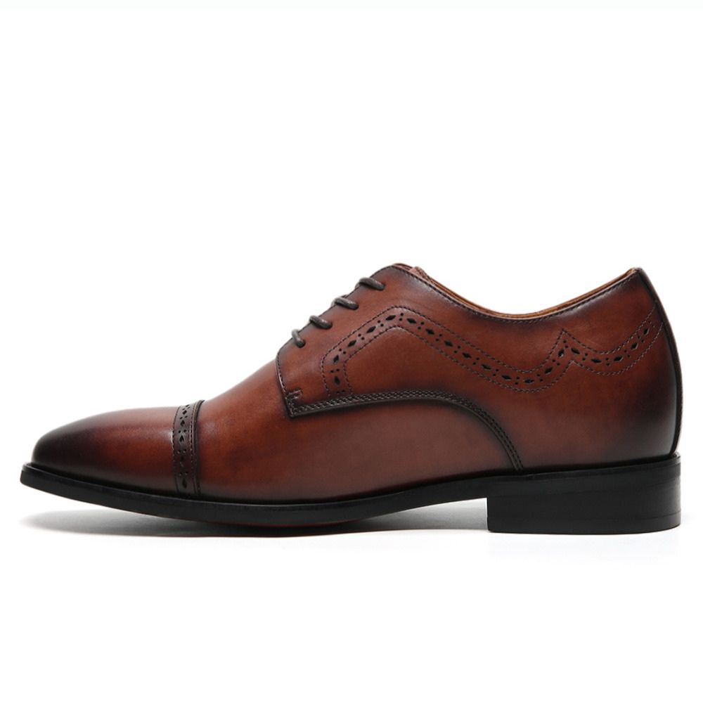 Mr. Mak leather elevator shoes for men paired with formal suit, discreetly adding 7cm height, enhancing posture, confidence, and timeless style for professional occasions
