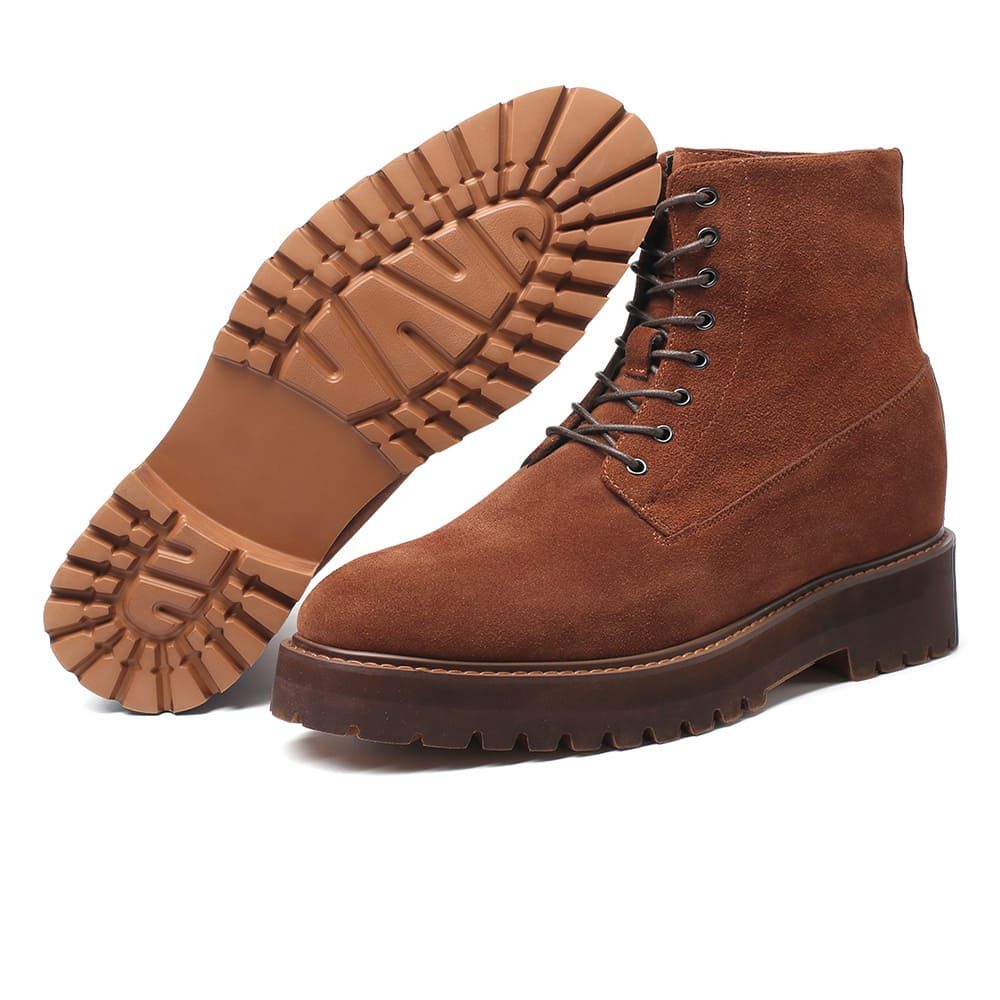 Pair of Mr. Moses brown suede elevator boots displaying 11 cm hidden lift and robust rubber outsole.