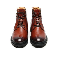 Brown leather boot with black sole