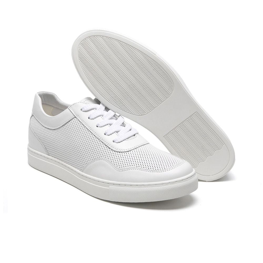 Angled view of all-white height-increasing sneakers with lace-up closure, breathable lining, and sleek silhouette for versatile style.