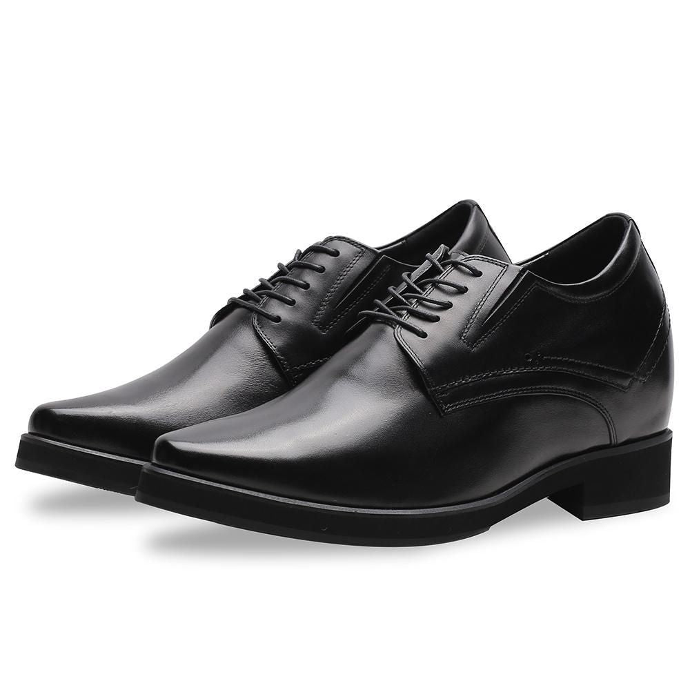 Close-up of premium black cow leather on Mr. Rachmaninoff elevator shoes, showing craftsmanship, brogue-free minimalist style, and subtle formal elegance.