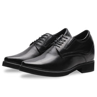 Close-up of premium black cow leather on Mr. Rachmaninoff elevator shoes, showing craftsmanship, brogue-free minimalist style, and subtle formal elegance.