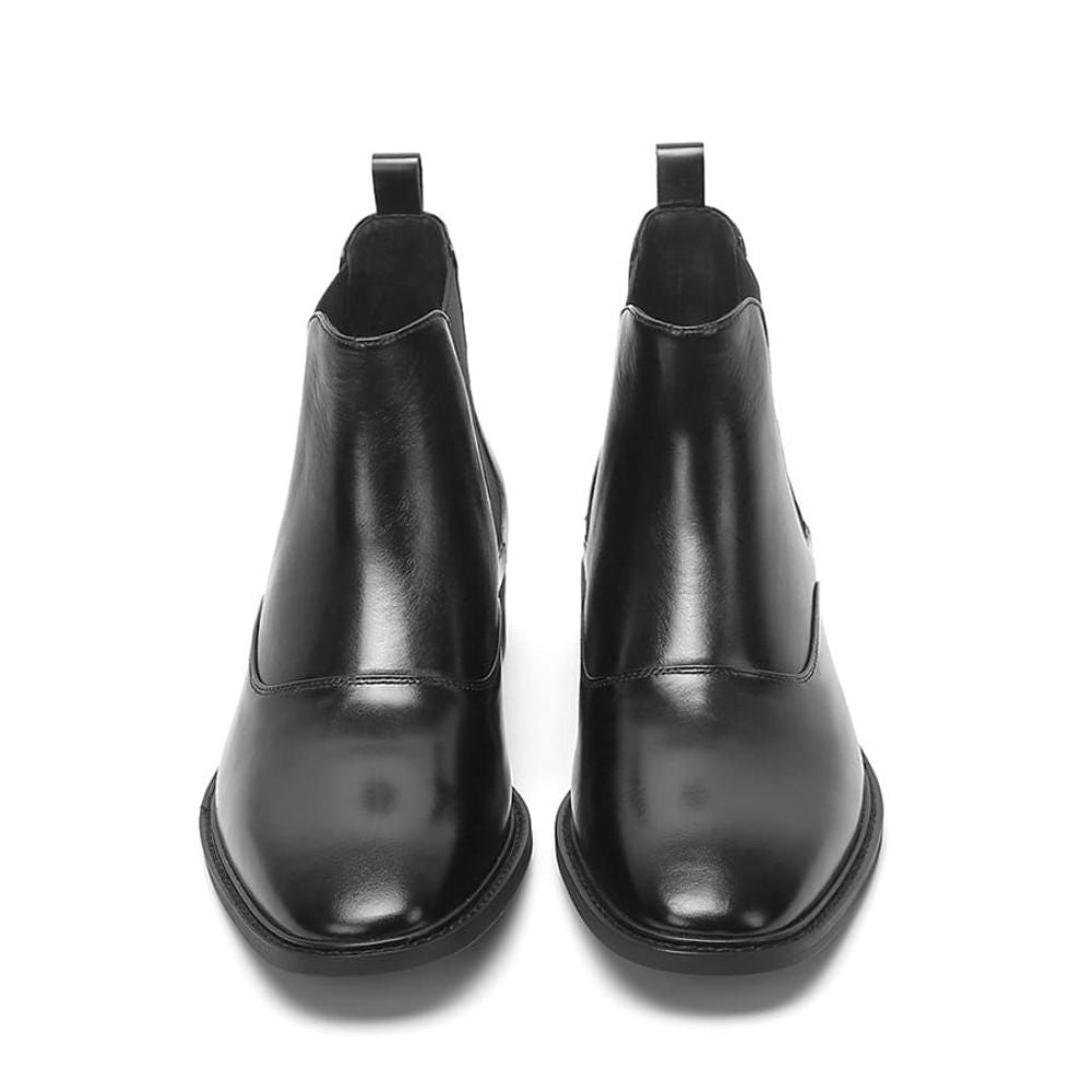 Sleek black formal slip-on boots with a smooth leather finish