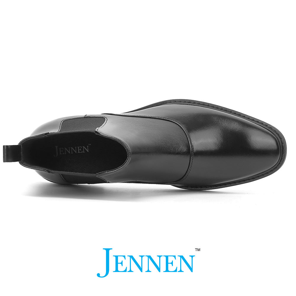 Sleek black formal slip-on boots with a smooth leather finish