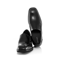 Men’s black leather height-increasing slip-on shoes featuring 7cm total lift and durable premium rubber outsole.